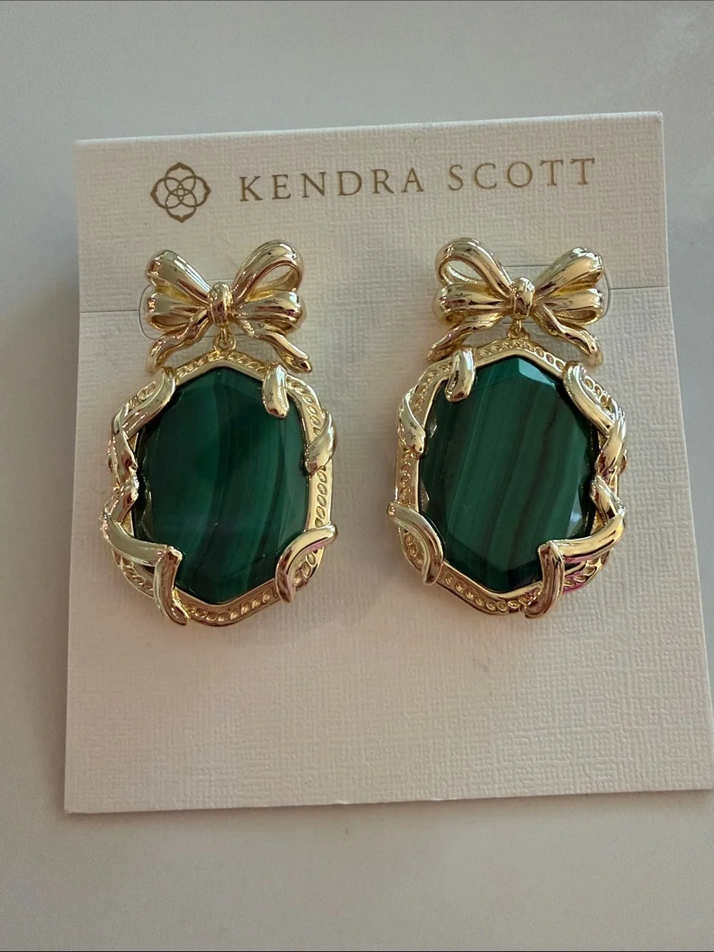 Kendra Scott Gold Bow Earrings with Emerald-Green Stones